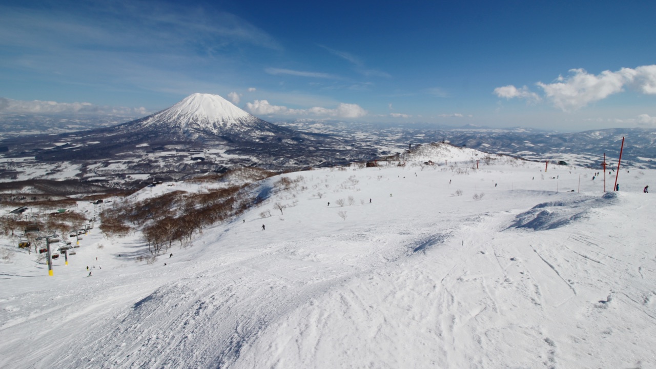 Snow-covered slopes at Niseko Grand Hirafu, with Mount Yōtei rising above the valley.