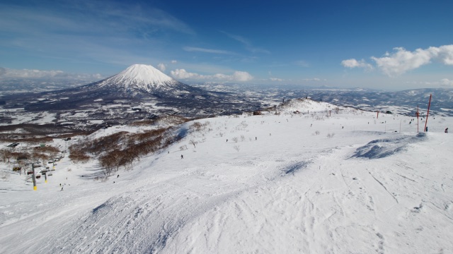 Snow-covered slopes at Niseko Grand Hirafu, with Mount Yōtei rising above the valley.